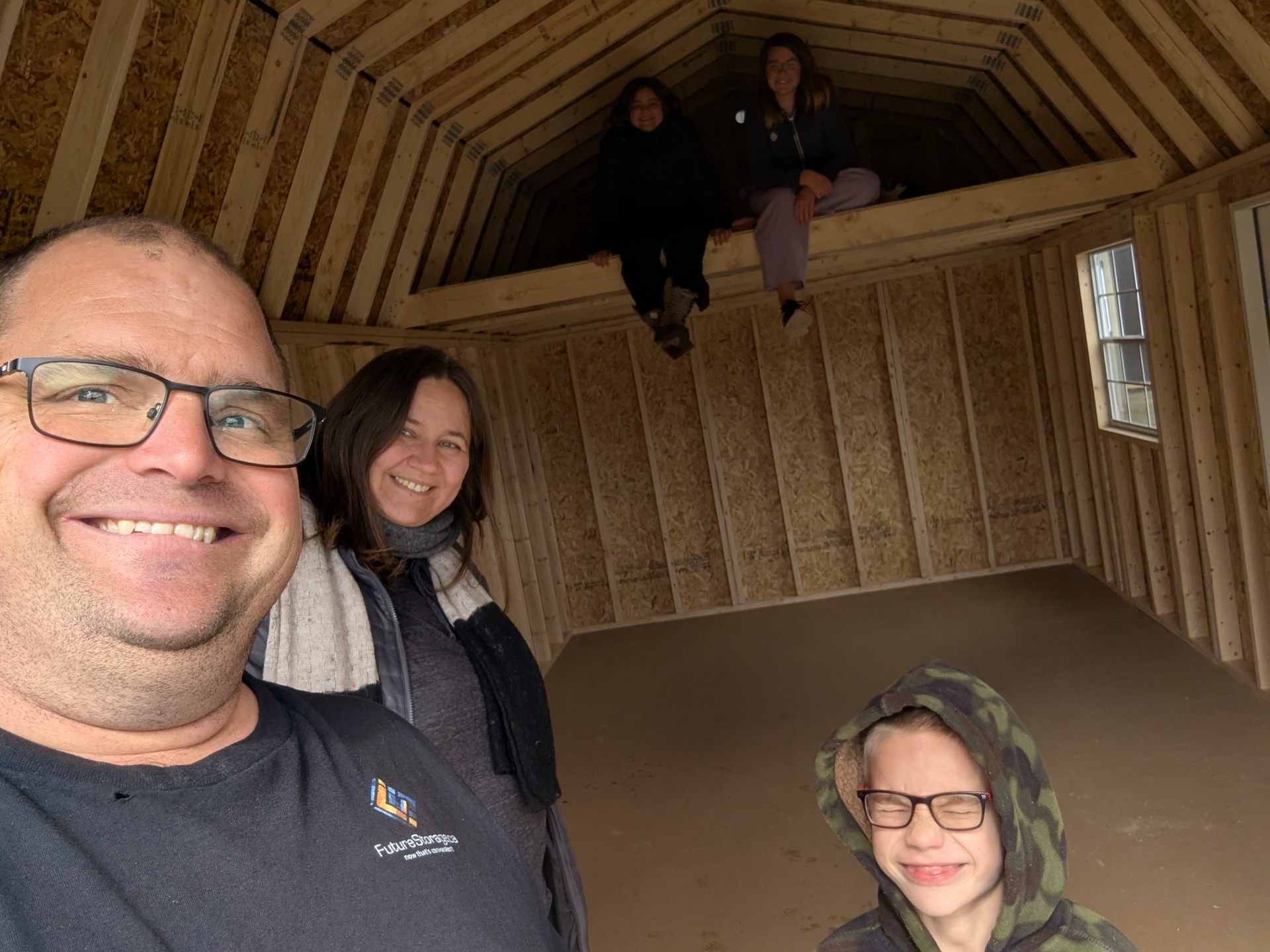 Dan Postma and family inside a Premier Portable Building